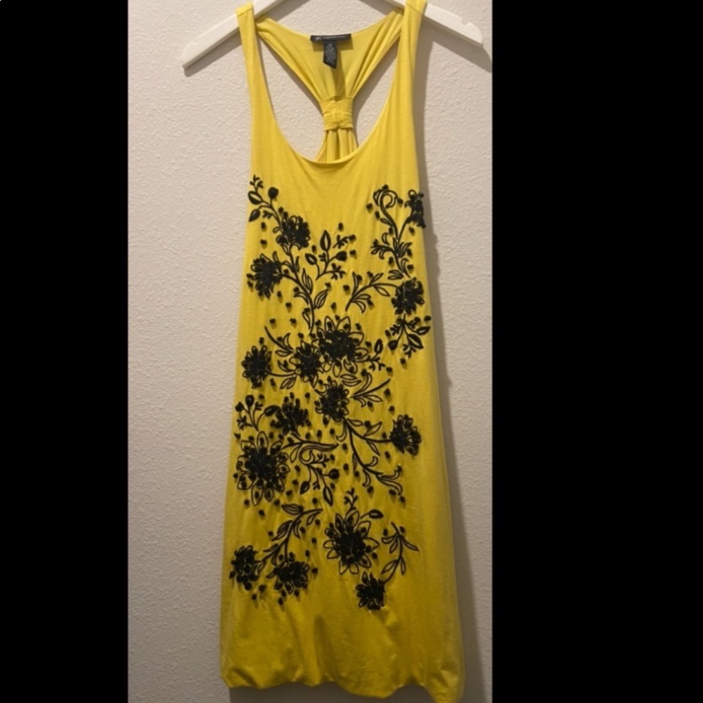 XS INC yellow dress with beautiful black floral designs.